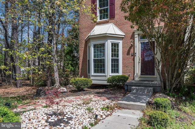 property entrance with brick siding