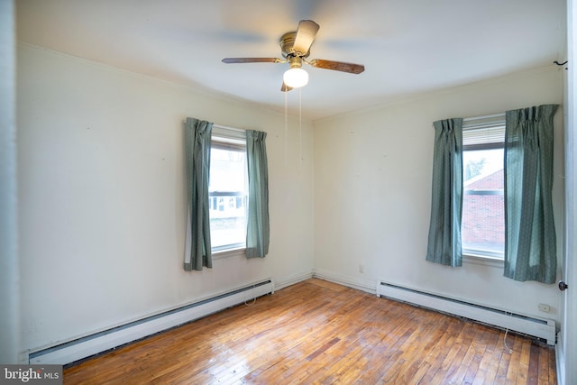 139 Kimport Ave, Boalsburg, PA 16827 - spare room with baseboard heating, light wood-style floors, ceiling fan, and crown molding