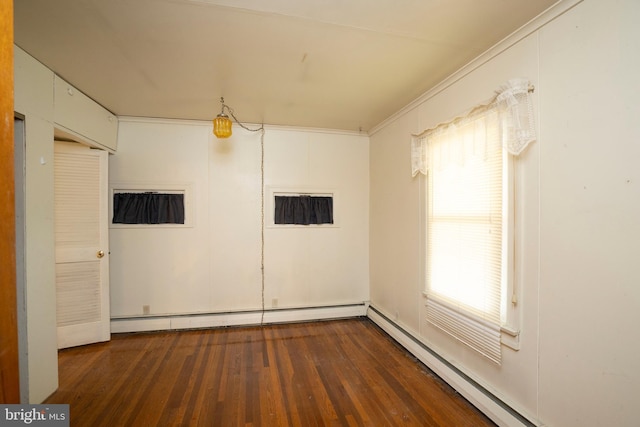 139 Kimport Ave, Boalsburg, PA 16827 - empty room featuring a baseboard heating unit, wood finished floors, plenty of natural light, baseboard heating, and ornamental molding