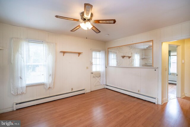 139 Kimport Ave, Boalsburg, PA 16827 - empty room with a baseboard heating unit, wood finished floors, and a ceiling fan