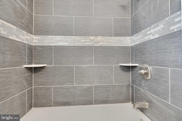 bathroom featuring  shower combination