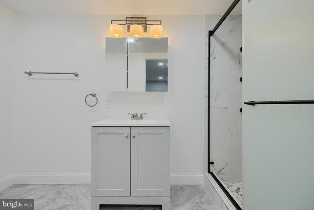 bathroom featuring a marble finish shower, marble finish floor, and baseboards