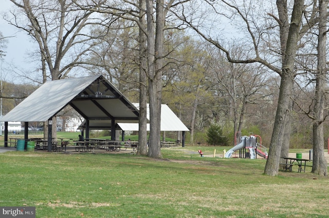 view of property's community featuring a gazebo, playground community, and a yard