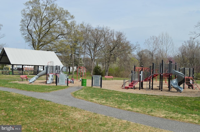 communal playground featuring a yard