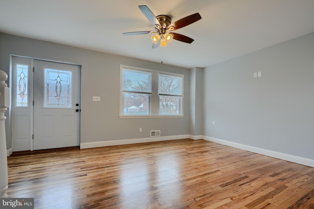 foyer featuring light wood-type flooring, visible vents, and plenty of natural light