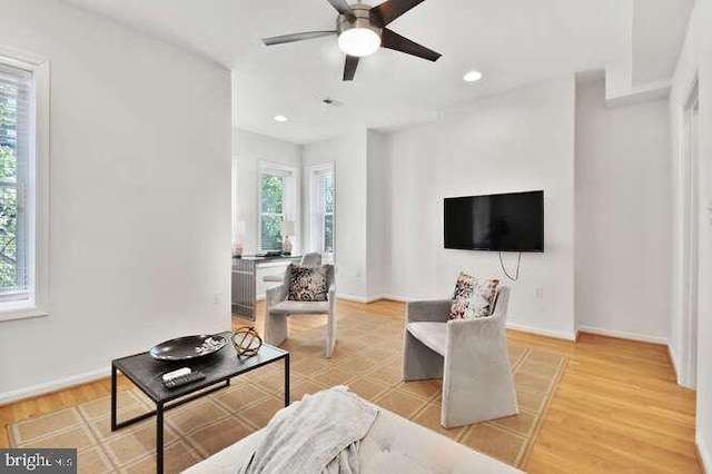 living room with a ceiling fan, baseboards, recessed lighting, light wood-type flooring, and visible vents