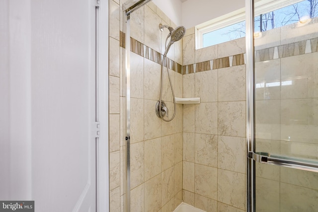 full bathroom featuring a shower stall
