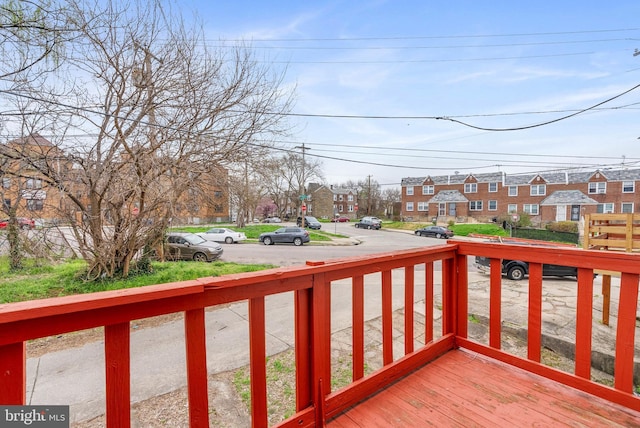 wooden deck with a residential view