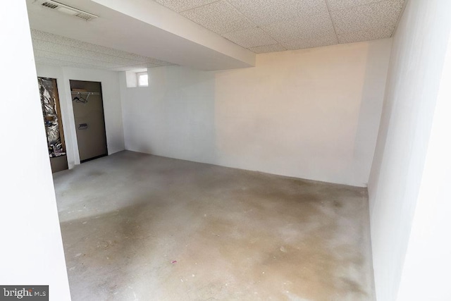 below grade area featuring visible vents and a paneled ceiling