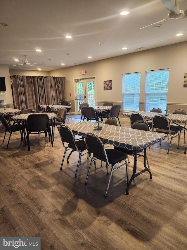 dining area with wood finished floors, a ceiling fan, and recessed lighting