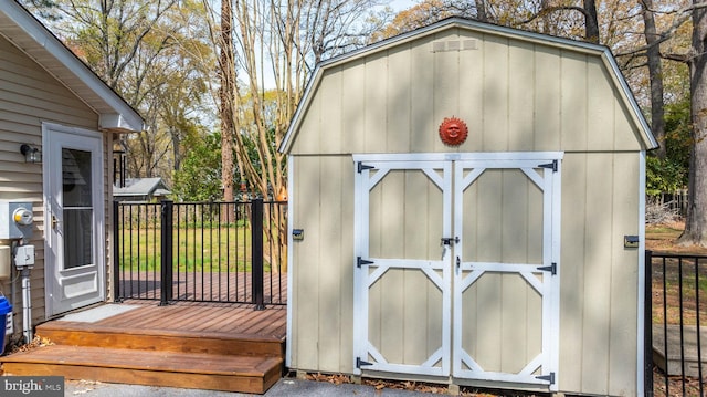 view of shed with fence