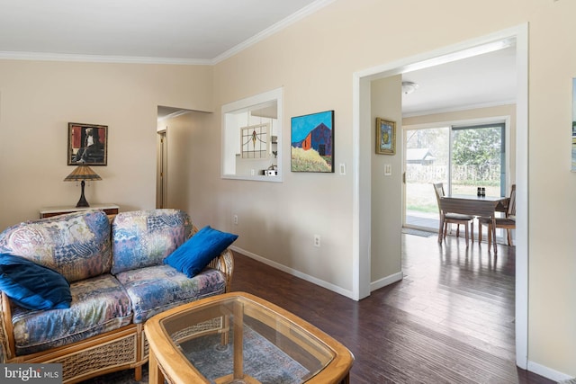 living area featuring wood finished floors, baseboards, and ornamental molding
