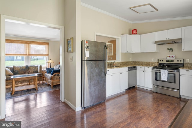 kitchen featuring a sink, ornamental molding, light stone counters, under cabinet range hood, and appliances with stainless steel finishes