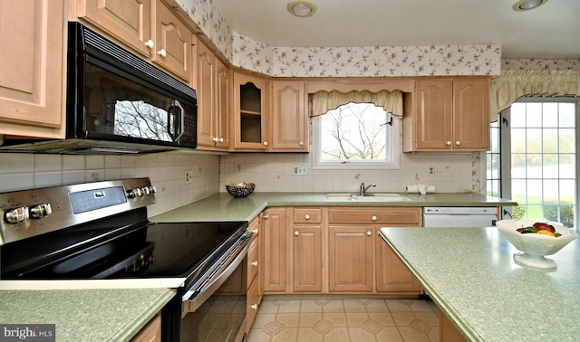 745 Champlain Dr, King Of Prussia, PA 19406 - kitchen with stainless steel range with electric cooktop, black microwave, dishwasher, a sink, and wallpapered walls