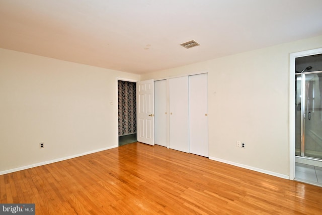 745 Champlain Dr, King Of Prussia, PA 19406 - unfurnished bedroom with visible vents, baseboards, two closets, and light wood-style floors