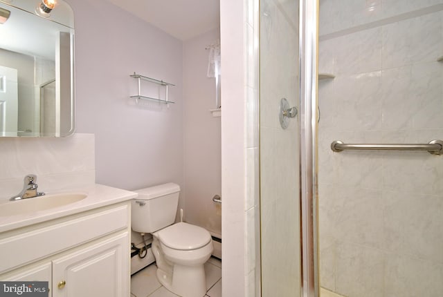 745 Champlain Dr, King Of Prussia, PA 19406 - full bathroom with a shower stall, vanity, toilet, a baseboard radiator, and tile patterned floors