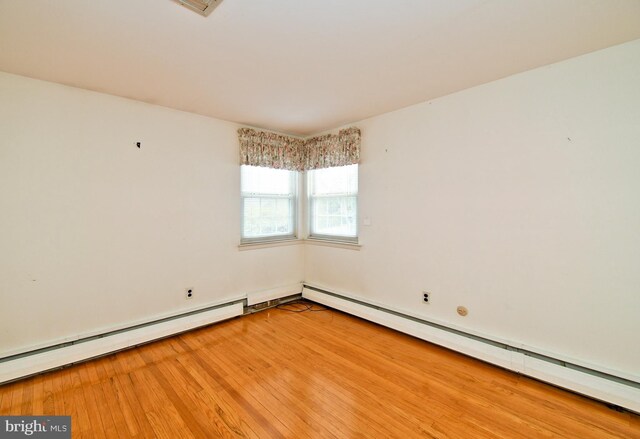745 Champlain Dr, King Of Prussia, PA 19406 - empty room featuring baseboard heating and light wood-style flooring