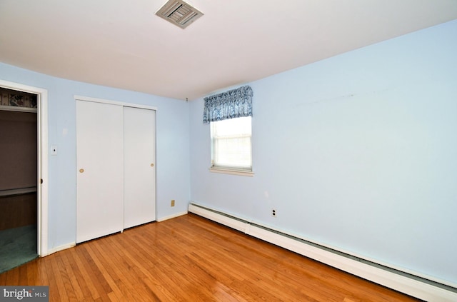 745 Champlain Dr, King Of Prussia, PA 19406 - unfurnished bedroom with a closet, baseboard heating, light wood-type flooring, and visible vents