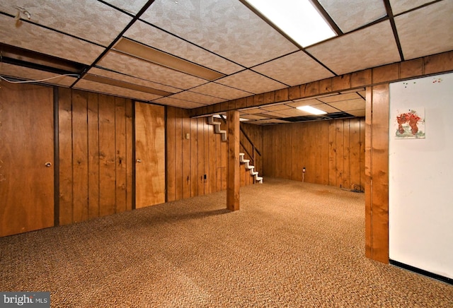 745 Champlain Dr, King Of Prussia, PA 19406 - finished basement with freestanding refrigerator, carpet, wooden walls, stairway, and a drop ceiling