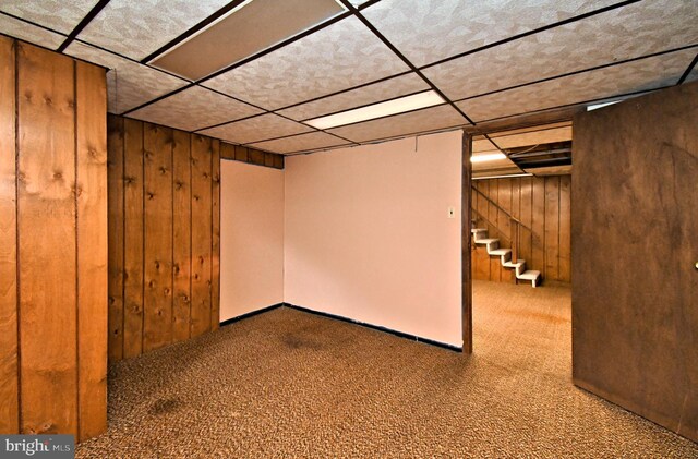 745 Champlain Dr, King Of Prussia, PA 19406 - finished basement with wooden walls, a drop ceiling, carpet, and stairway
