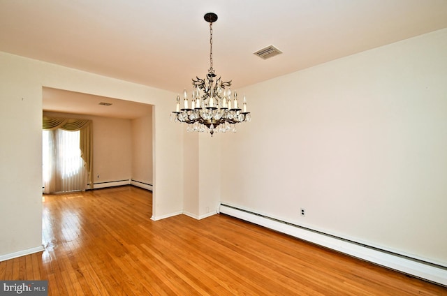 745 Champlain Dr, King Of Prussia, PA 19406 - unfurnished dining area with light wood-style floors, visible vents, a baseboard heating unit, baseboards, and a notable chandelier