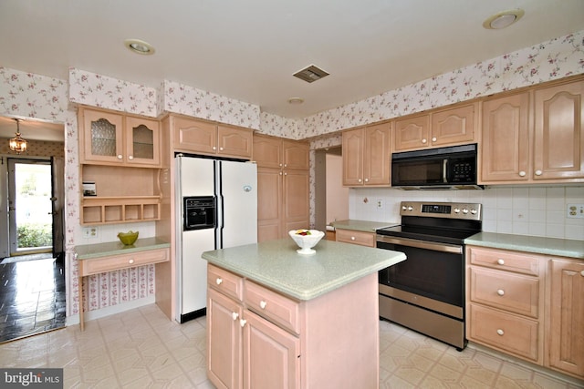 745 Champlain Dr, King Of Prussia, PA 19406 - kitchen featuring light brown cabinets, wallpapered walls, black microwave, stainless steel electric range oven, and white refrigerator with ice dispenser