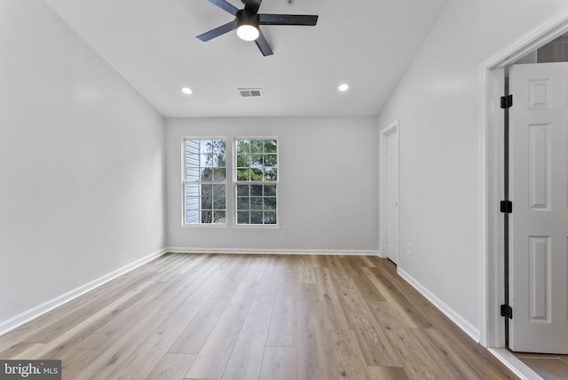 unfurnished room featuring wood finished floors, ceiling fan, baseboards, and visible vents