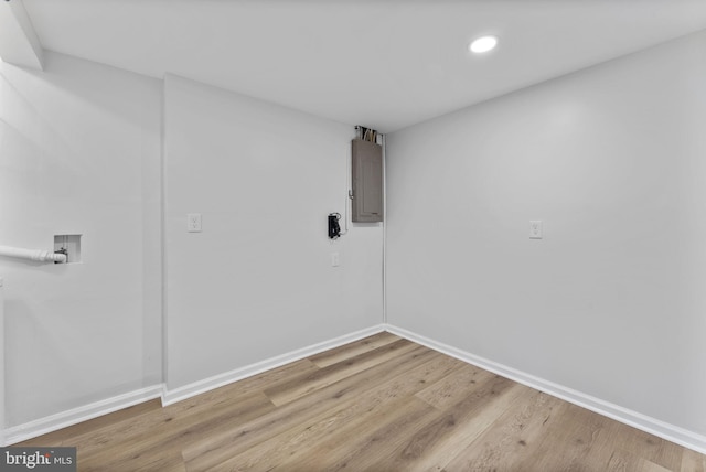 laundry room featuring laundry area, washer hookup, baseboards, and electric panel