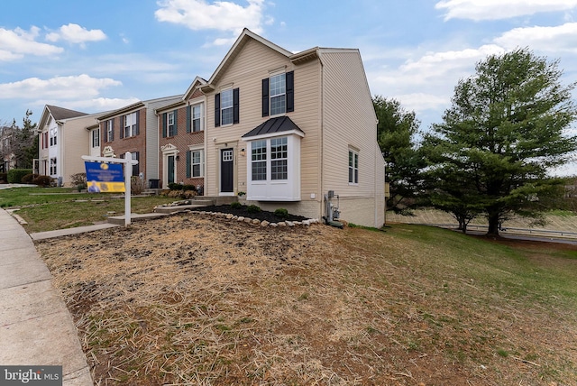 view of front of property featuring a front yard and a residential view