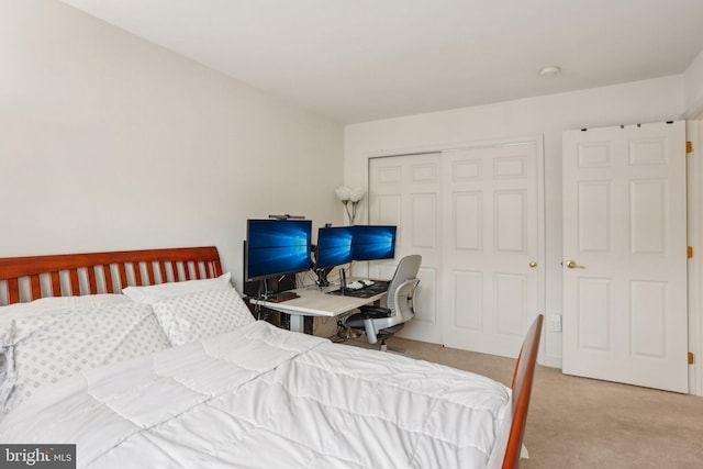 carpeted bedroom with a closet
