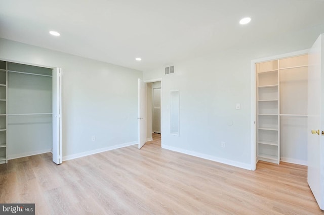 unfurnished bedroom with light wood finished floors, visible vents, and recessed lighting