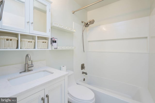 full bathroom with bathtub / shower combination, vanity, and toilet