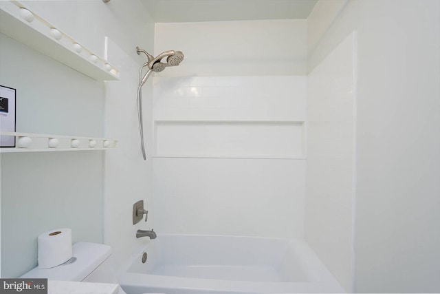 bathroom featuring toilet and bathtub / shower combination