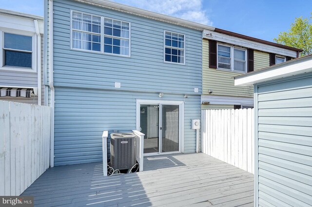 wooden deck with central AC and fence