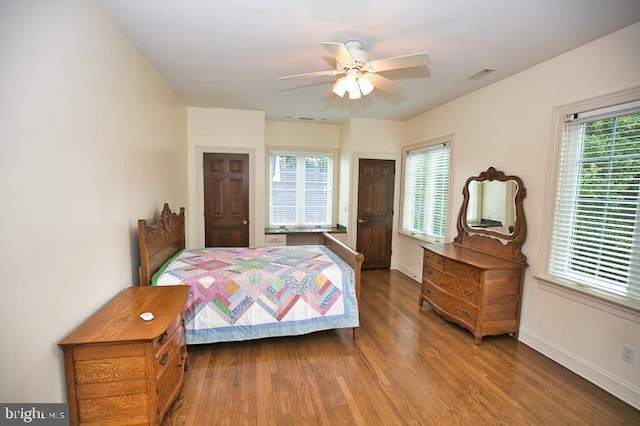 712 Riverside Pines Ct, Salisbury, MD 21801 - bedroom with wood finished floors, baseboards, and ceiling fan