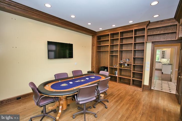 712 Riverside Pines Ct, Salisbury, MD 21801 - game room with recessed lighting, wood finished floors, ornamental molding, baseboards, and built in features