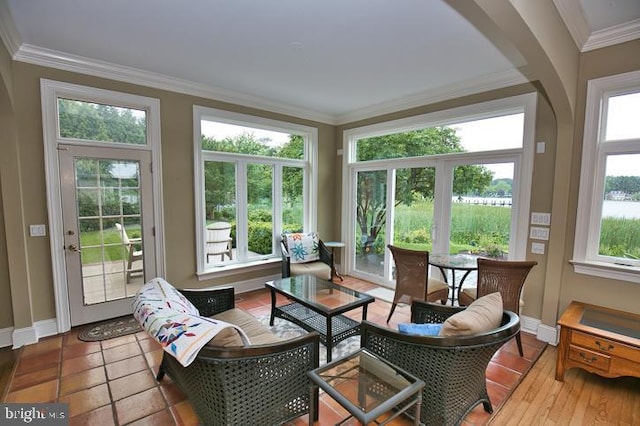 712 Riverside Pines Ct, Salisbury, MD 21801 - sunroom featuring plenty of natural light, crown molding, baseboards, and a wooden deck