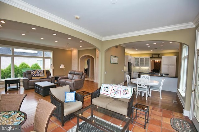 712 Riverside Pines Ct, Salisbury, MD 21801 - living room featuring arched walkways, crown molding, recessed lighting, and baseboards
