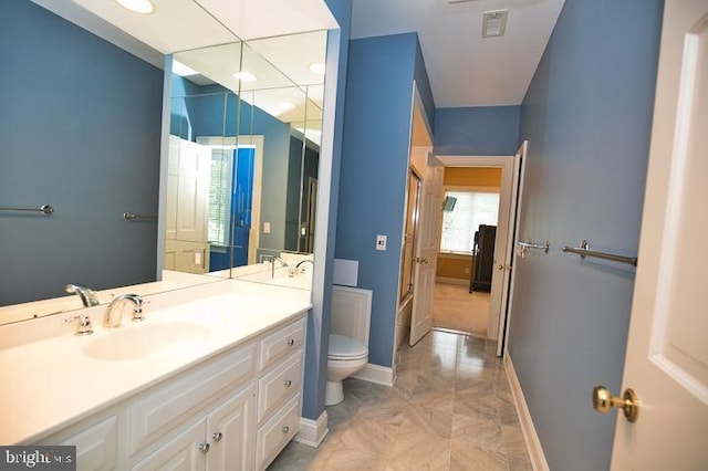 712 Riverside Pines Ct, Salisbury, MD 21801 - full bathroom featuring toilet, baseboards, vanity, and recessed lighting