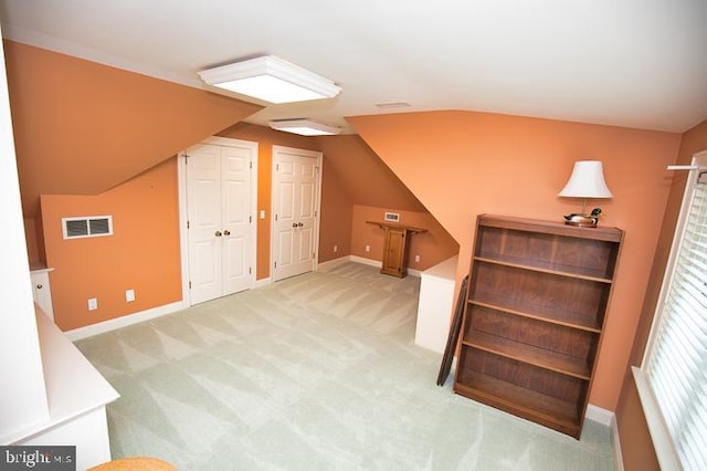 712 Riverside Pines Ct, Salisbury, MD 21801 - additional living space with lofted ceiling, light carpet, and baseboards