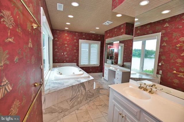 712 Riverside Pines Ct, Salisbury, MD 21801 - full bathroom with vanity, a tub with jets, recessed lighting, and marble finish floors