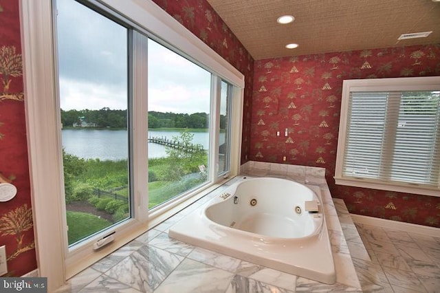 712 Riverside Pines Ct, Salisbury, MD 21801 - full bath with plenty of natural light, a jetted tub, a water view, marble look tile flooring, and recessed lighting