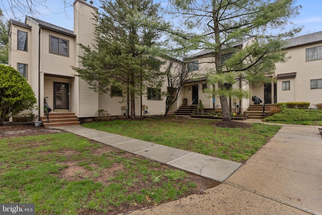 14 Cedar Ct, Flemington, NJ 08822 - view of front of house with a front yard and a chimney
