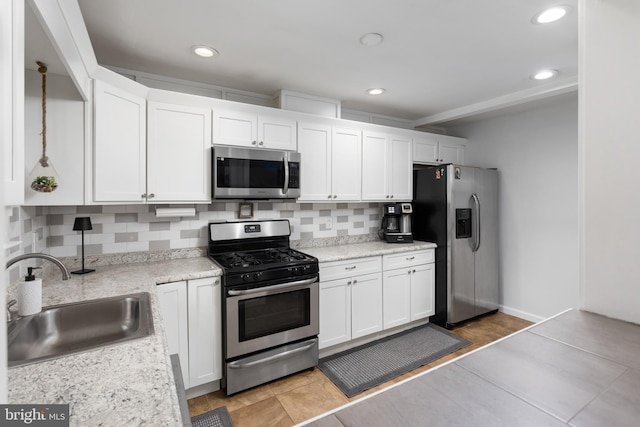 14 Cedar Ct, Flemington, NJ 08822 - kitchen with appliances with stainless steel finishes, a sink, tasteful backsplash, white cabinets, and recessed lighting