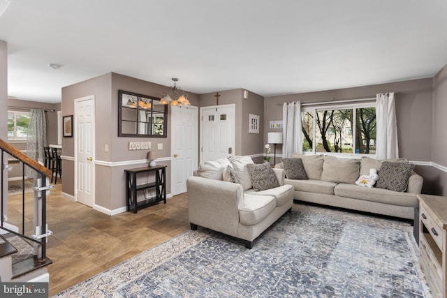 14 Cedar Ct, Flemington, NJ 08822 - living room with a chandelier, stairs, and baseboards