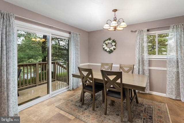 14 Cedar Ct, Flemington, NJ 08822 - tiled dining area with plenty of natural light, a chandelier, and baseboards