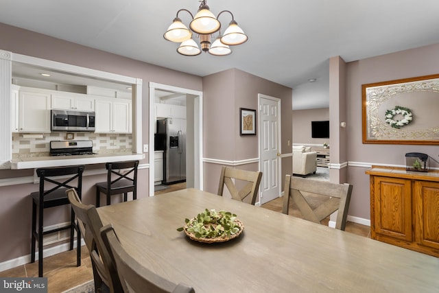 14 Cedar Ct, Flemington, NJ 08822 - dining space with a chandelier and baseboards