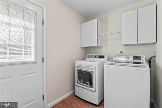 132 Heatherington Ct, Lanoka Harbor, NJ 08734 - clothes washing area featuring separate washer and dryer, wood finished floors, baseboards, and cabinet space