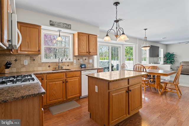 132 Heatherington Ct, Lanoka Harbor, NJ 08734 - kitchen with light wood-style flooring, backsplash, a sink, and white appliances