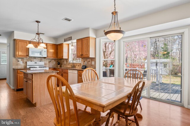 132 Heatherington Ct, Lanoka Harbor, NJ 08734 - dining space with visible vents, light wood-style flooring, and plenty of natural light